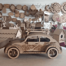 Wooden decorative car model showcasing intricate design, surrounded by crafted wooden art pieces.